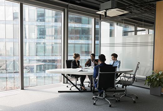 Financial services professionals reviewing investment and market data