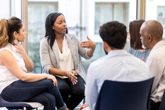 Diverse team of B2B research professionals collaborating on survey panel strategy